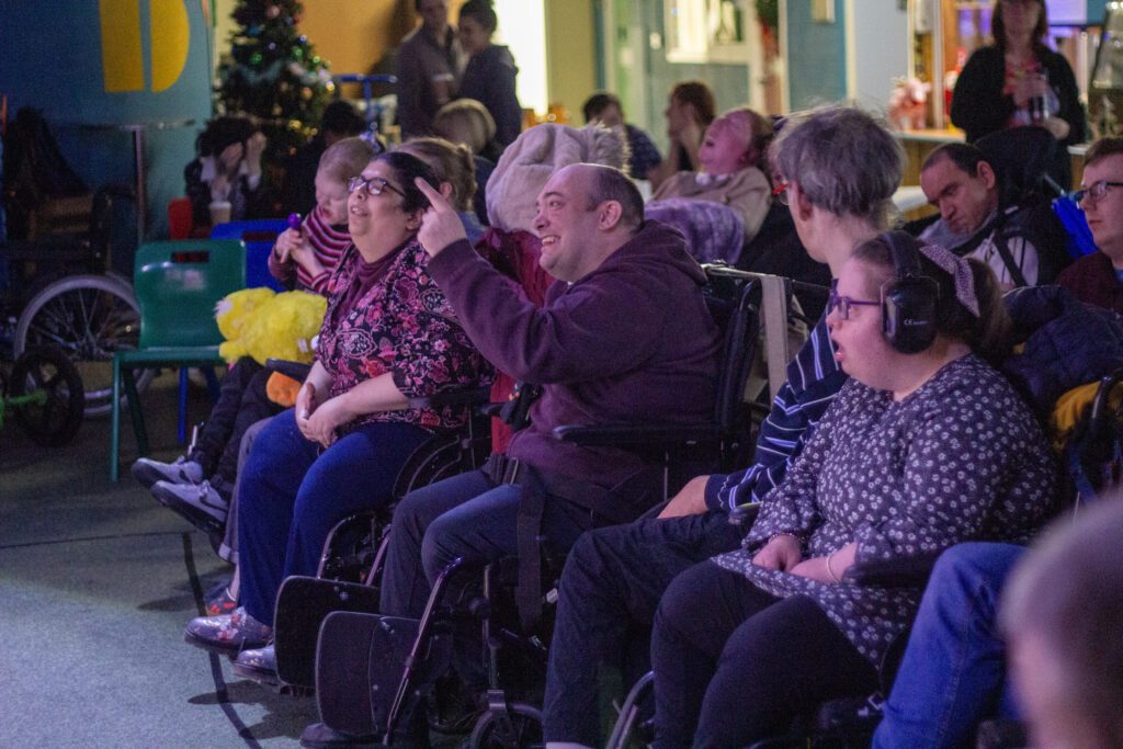Pantomime at Burton Street Sheffield for people with learning disabilities. Client is happy.