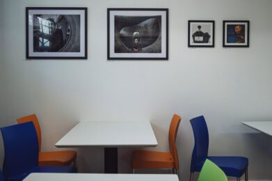 photographs on the walls and tables in the community cafe