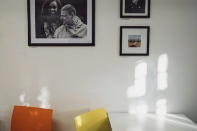 photography of clients on the walls in the burton street community cafe