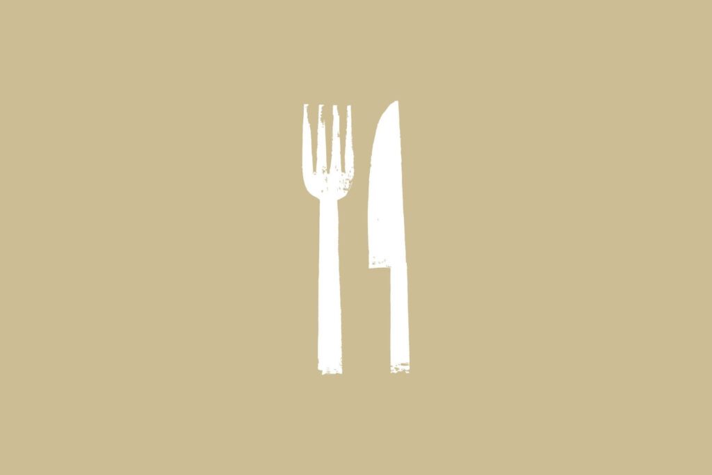 White fork and knife on brown background.