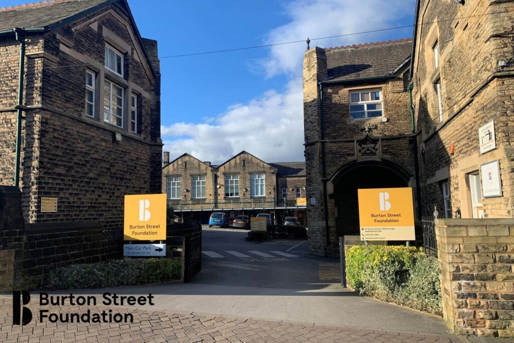 A view of the entrance to Burton Street Foundation, showcasing its inviting doorway and clear signage for visitors.