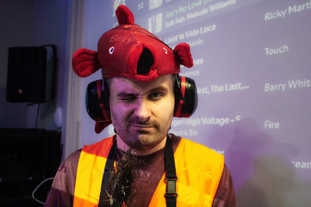 Person with learning disabiliy and autism posing for photo at Burton Street Foundation