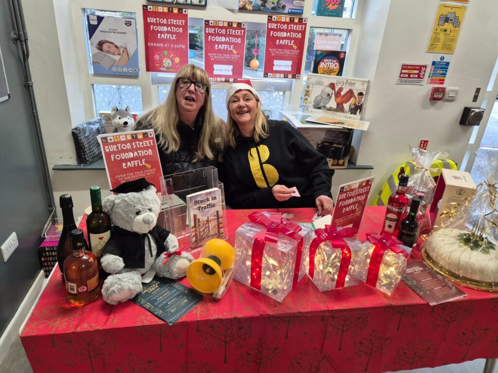 Two staff members at Burton Street Foundation at the annual Christmas Market