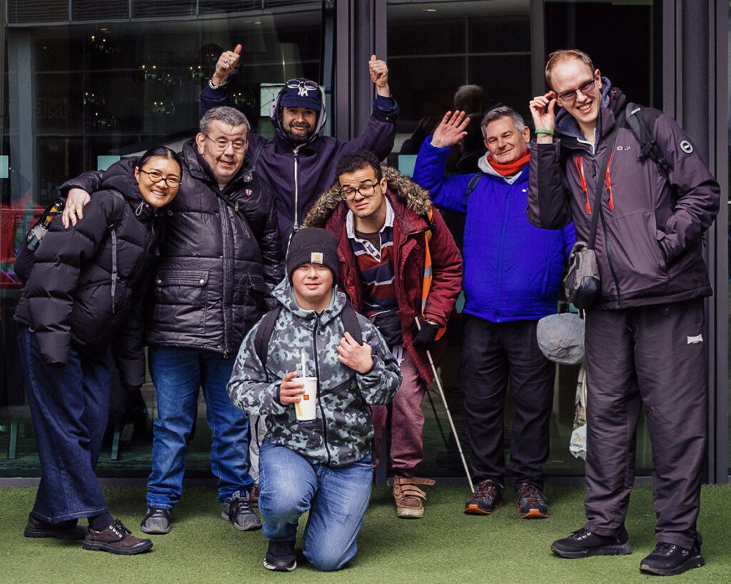 Disabled adults of creative filming session outside art gallery at a festival launch event in Sheffield