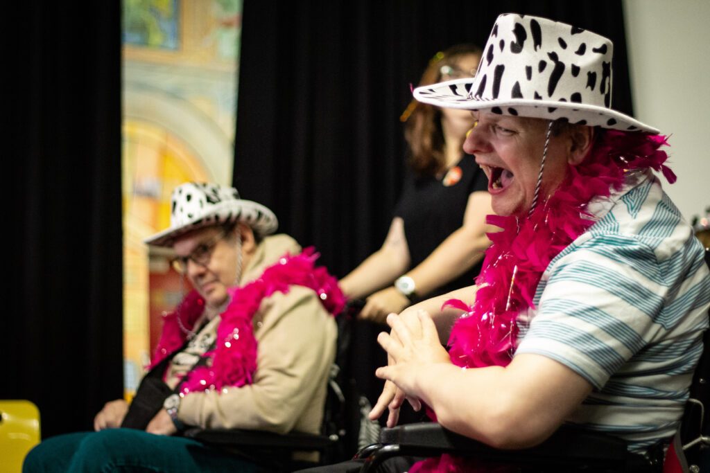 Adult with learning disability performing on stage at Burton Street Foundation in Sheffield
