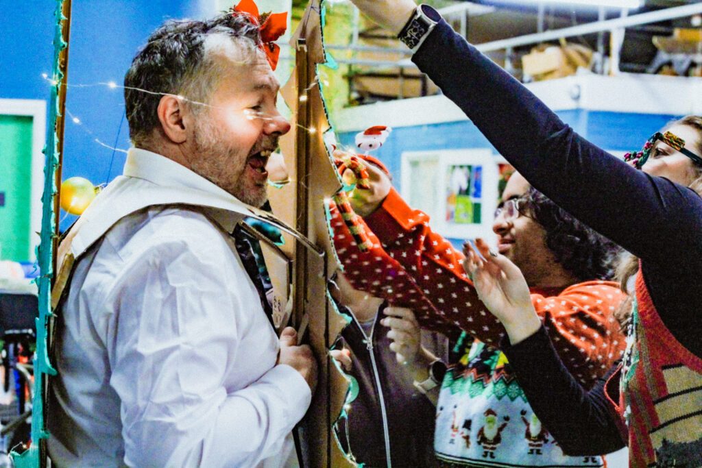 Support Worker having fun with people with learning disabilities at Burton Street Foundation in Sheffield