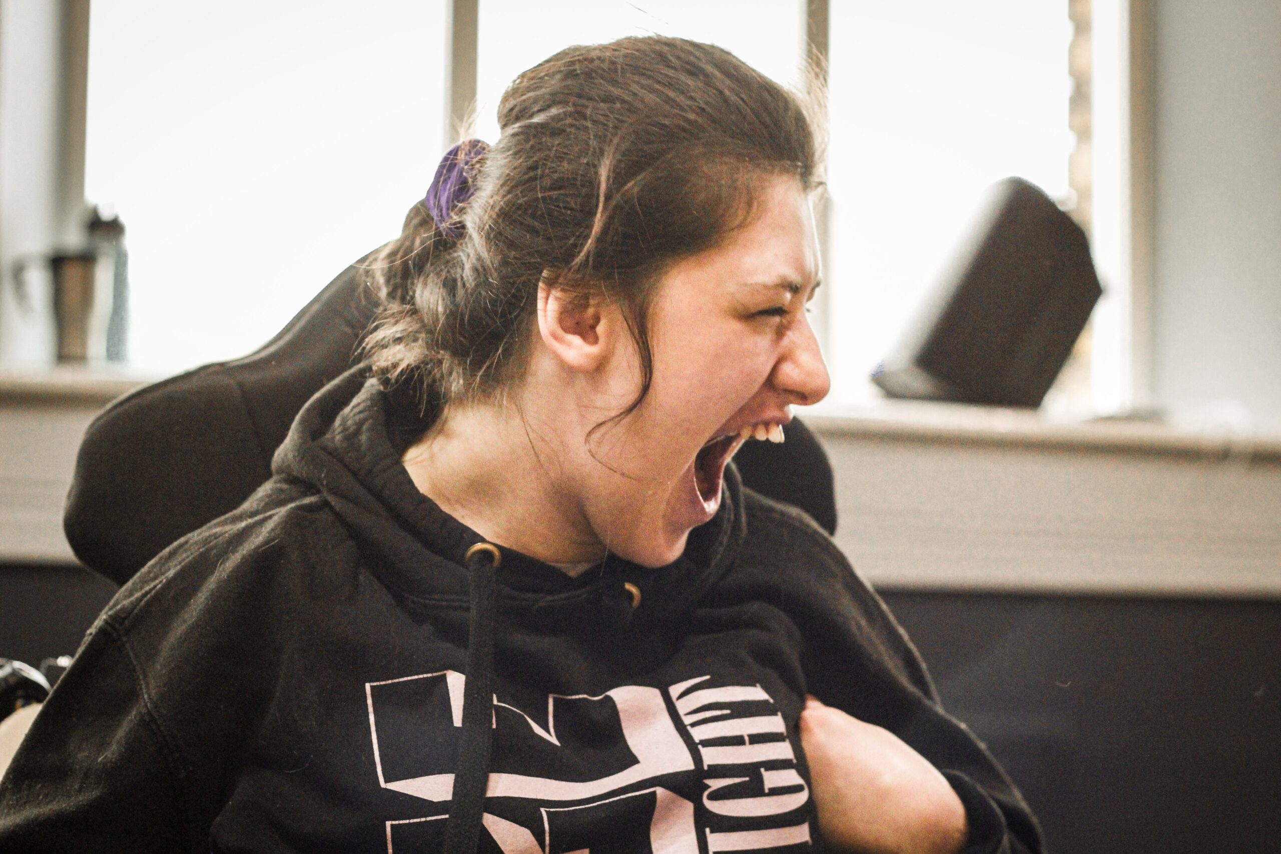 Woman with learning disability laughing at Burton Street Foundation in Sheffield