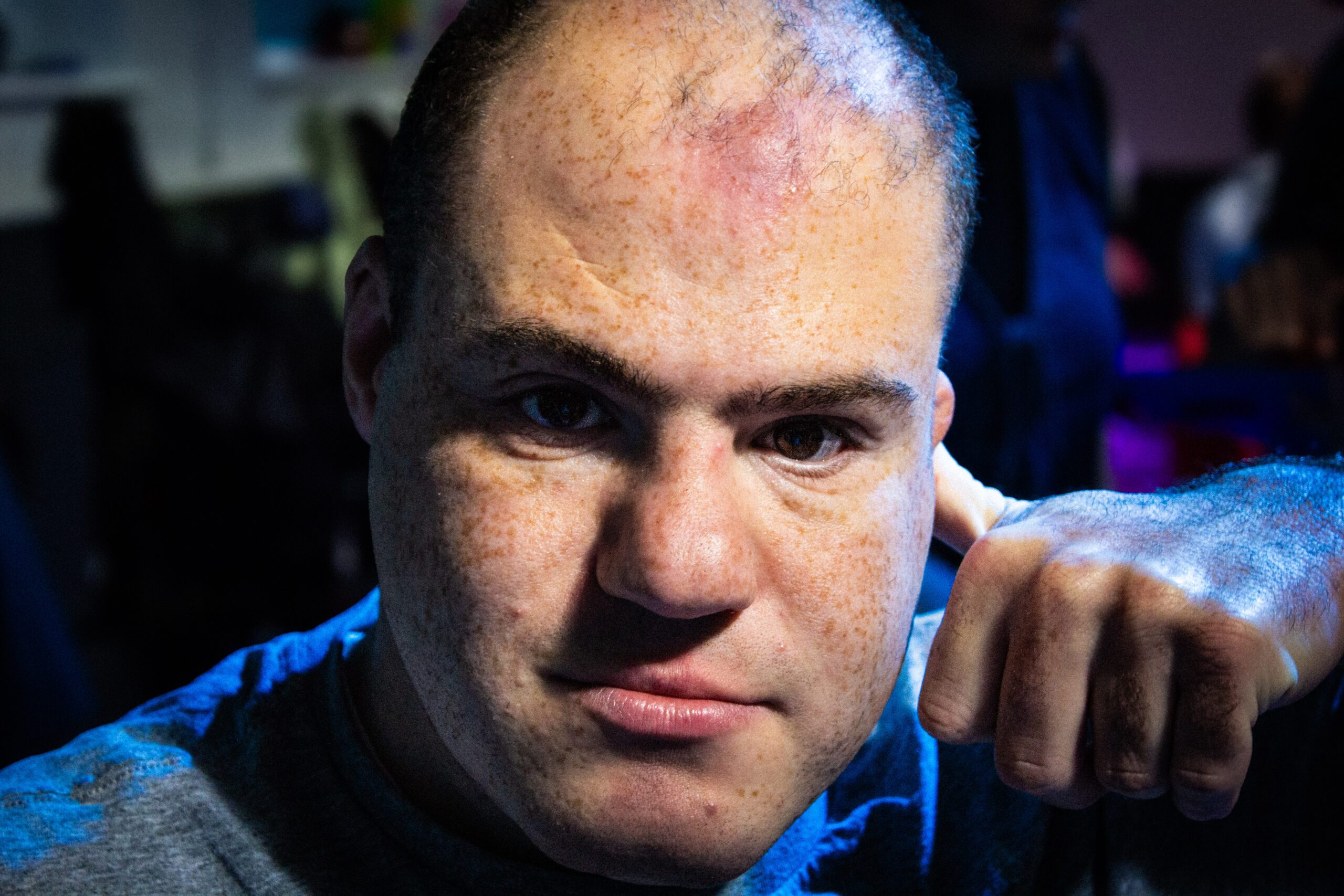 Man with learning disability smiling for camera at Burton Street Foundation in Sheffield